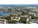 Stunning aerial view of the condo community, surrounded by lush greenery and glistening lakes at 622 Spring Lakes Blvd, Bradenton, FL 34210