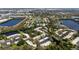 Aerial view of the community featuring ponds, trees and recreation area at 622 Spring Lakes Blvd, Bradenton, FL 34210