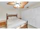 Bedroom featuring bamboo style bed frame, ceiling fan and closet at 622 Spring Lakes Blvd, Bradenton, FL 34210