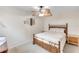 Bedroom with ceiling fan and bamboo style bed frame with decorative pillows at 622 Spring Lakes Blvd, Bradenton, FL 34210
