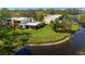 Attractive exterior view of waterfront condo building with lush green lawn at 622 Spring Lakes Blvd, Bradenton, FL 34210