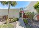 Charming single-story home with a well-maintained walkway, inviting curb appeal, and colorful landscaping at 622 Spring Lakes Blvd, Bradenton, FL 34210