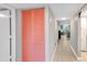 Hallway featuring closet with pink doors leading into the living spaces at 622 Spring Lakes Blvd, Bradenton, FL 34210