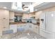 Renovated kitchen showcasing granite counters, white cabinets, and stainless steel appliances, a chef's dream at 622 Spring Lakes Blvd, Bradenton, FL 34210
