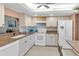 Bright, updated kitchen featuring white cabinets, granite countertops, and stainless steel appliances at 622 Spring Lakes Blvd, Bradenton, FL 34210