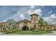 Community clubhouse featuring well-manicured lawns and lush landscaping, creating a welcoming atmosphere at 6519 Grand Estuary Trl # 101, Bradenton, FL 34212