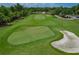 Aerial view of the lush green golf course with sand traps and neatly manicured greens at 6519 Grand Estuary Trl # 101, Bradenton, FL 34212