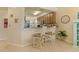 Kitchen with breakfast bar featuring granite countertops, stainless steel appliances, and modern cabinetry at 6519 Grand Estuary Trl # 101, Bradenton, FL 34212