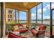 Relaxing screened-in lanai with comfortable seating and views of the lush landscape at 6519 Grand Estuary Trl # 101, Bradenton, FL 34212