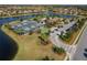 Aerial shot showcases the community pickleball and basketball courts with surrounding landscaping and parking at 6519 Grand Estuary Trl # 101, Bradenton, FL 34212