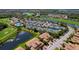 Aerial shot displays the community amenities including the pool, tennis courts, and waterways at 6519 Grand Estuary Trl # 101, Bradenton, FL 34212