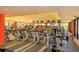 Well-equipped gym with treadmills, exercise machines, and TV screens for an active lifestyle at 6621 The Masters Ave, Lakewood Ranch, FL 34202