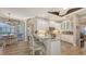 Open kitchen with granite countertops, stainless steel appliances, and a breakfast bar at 6621 The Masters Ave, Lakewood Ranch, FL 34202