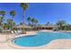 Inviting swimming pool with a sun-drenched patio, ideal for relaxing and entertaining while enjoying the beautiful scenery at 6621 The Masters Ave, Lakewood Ranch, FL 34202