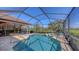 Sparkling swimming pool surrounded by a screened enclosure, offering a private and refreshing outdoor retreat at 6621 The Masters Ave, Lakewood Ranch, FL 34202