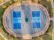 Overhead shot of a fenced pickleball court, offering a well-maintained space for recreational sports and community activities at 7021 Feather Wood Dr, Sun City Center, FL 33573