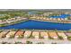 Beautiful aerial view of homes and a lake in a sunny Florida neighborhood at 7036 Whittlebury Trl, Lakewood Ranch, FL 34202