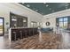 Clubhouse interior with a bar, lounge seating, high ceilings, and elegant decor at 7036 Whittlebury Trl, Lakewood Ranch, FL 34202