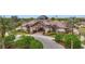 Beautiful community building featuring lush landscaping, well-manicured lawns, and resort-style living at 7036 Whittlebury Trl, Lakewood Ranch, FL 34202
