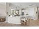 Open-concept kitchen features a center island, stainless steel appliances, and a breakfast bar at 7036 Whittlebury Trl, Lakewood Ranch, FL 34202