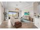 Cozy living room with a large window, comfortable seating, and stylish decor at 7036 Whittlebury Trl, Lakewood Ranch, FL 34202