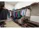 Organized walk-in closet with ample shelving, hanging space, and efficient storage solutions at 7036 Whittlebury Trl, Lakewood Ranch, FL 34202
