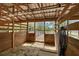 The barn interior offers wooden stalls, a metal roof, and ample natural light creating a functional and comfortable space at 7108 229Th E St, Bradenton, FL 34211