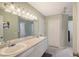 Bright bathroom with a double vanity sink, ceiling fan, and tile flooring at 7108 229Th E St, Bradenton, FL 34211