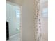 Bathroom with shower and floral shower curtain at 7108 229Th E St, Bradenton, FL 34211