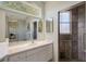 Bathroom featuring a glass enclosed tiled shower, vanity, and built in mirror at 7108 229Th E St, Bradenton, FL 34211