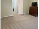 Spacious bedroom with neutral carpet, dresser, and ample doorway access at 7108 229Th E St, Bradenton, FL 34211