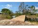 Newly constructed wooden bridge over a stream, enhancing the natural beauty of this unique property at 7108 229Th E St, Bradenton, FL 34211