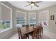 Charming dining area with large windows offering views of the pool and outdoor space at 7108 229Th E St, Bradenton, FL 34211