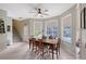 Bright dining room with expansive windows showcasing the pool area and access to the backyard at 7108 229Th E St, Bradenton, FL 34211