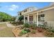 Exterior view of the home with a front porch, walkway, and landscaped garden at 7108 229Th E St, Bradenton, FL 34211