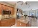 Well-equipped kitchen featuring stainless steel appliances, granite counters, and views into the sunny breakfast nook at 7108 229Th E St, Bradenton, FL 34211