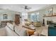 Comfortable living room with tiled floors, a fireplace, and natural light from the large window at 7108 229Th E St, Bradenton, FL 34211