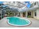 Beautiful caged pool with an outdoor spa and ample space for relaxing and entertaining at 7108 229Th E St, Bradenton, FL 34211