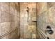 Accessible tiled shower features grab bars, a handheld shower head, and a bench at 7108 229Th E St, Bradenton, FL 34211