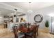 Elegant dining room open to the kitchen, featuring a modern chandelier at 7612 Lake Vista Ct # 406, Lakewood Ranch, FL 34202