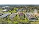 Aerial view of a home with screened pool, near a lake and other community residences at 8124 115Th E Ave, Parrish, FL 34219