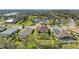 Aerial view of a home with screened pool, near a lake and other community residences at 8124 115Th E Ave, Parrish, FL 34219