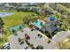 Aerial view of community amenities, featuring a swimming pool, tennis court, and ample parking at 8124 115Th E Ave, Parrish, FL 34219