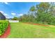 Large backyard with lush green grass and manicured landscaping at 8124 115Th E Ave, Parrish, FL 34219