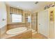 This bathroom boasts a glass shower enclosure and soaking tub at 8124 115Th E Ave, Parrish, FL 34219