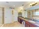 Bathroom with dual sinks, granite countertops, walk-in shower, and separate soaking tub at 8124 115Th E Ave, Parrish, FL 34219