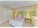 Well-lit bedroom featuring striped bedding, white furniture, and a fresh, clean aesthetic at 8124 115Th E Ave, Parrish, FL 34219