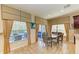 Dining area with lots of natural light and access to the outdoor space at 8124 115Th E Ave, Parrish, FL 34219