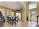 Elegant dining area with a chandelier, large window, and stylish decor at 8124 115Th E Ave, Parrish, FL 34219