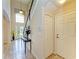 Inviting foyer with a high ceiling, tiled floor, and a decorative table at 8124 115Th E Ave, Parrish, FL 34219